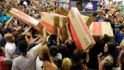 a crowd of shoppers on Black Friday
