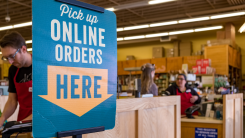 Sign that reads "pick up online orders here"